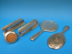 Two Art Nouveau design hallmarked silver mounted hand mirrors,