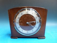 An unsusual Prudential insurance moneybox clock with penny slot to ensure the owner saved regularly