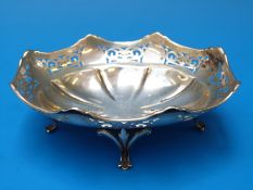 A pierced silver bon bon dish raised on four feet, Sheffield 1918, maker W.