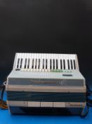 A c1960 Italian Transicord Faresia; 120 bass electronic accordion, in tri-colour green,