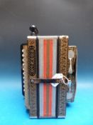 A German made c1970 Hohner four stop melodeon, in poker work case,