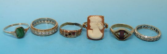 Three hallmarked 9ct gold rings two set with garnets and one with cubic zirconia,