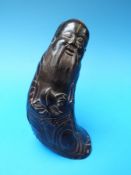 A Chinese horn figure of the immortal Shou Lao,