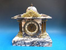 A French marble and onyx cased striking mantel clock (in light colour)