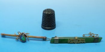 A yellow metal brooch marked 9ct gold depicting a spider set with a fire opal as the body and a