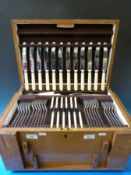 An oak-cased canteen of cutlery by James Dixon and Son,