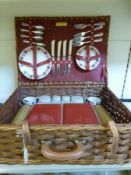 A retro 1950s/60s picnic set in original wicker basket by Sirram