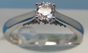 An 18ct white gold ring set with a diamond of approximately 0.