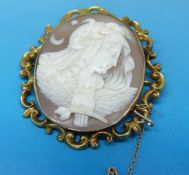 A cameo brooch depicting Nyx (Greek goddess of night) in yellow metal surround