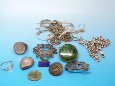 A collection of silver jewellery to include a locket, brooches, necklaces,