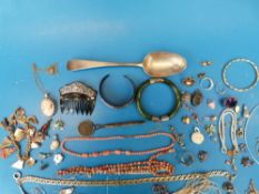 A Georgian silver spoon, cameo brooch with 9ct gold surround, silver necklace,