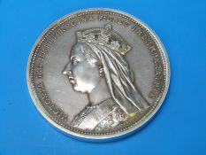 A white metal medallion by Alan Wyon commemorating Queen Victoria's Golden Jubilee,