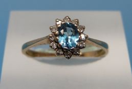 A 9ct gold ring set with topaz and diamonds (size N)