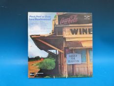 A collection of nine collectable LPs from Lee Hazlewood and five Nancy Sinatra LPs,