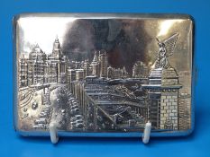 A Chinese white metal cigarette case with fine relief decoration of Shanghai waterfront and