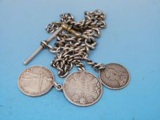 A hallmarked silver graduated watch chain mounted with a Transvaal war medallion and two other