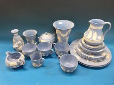 A large collection of Wedgwood Jasperware decorated with classical scenes,