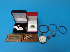 Three silver christening bracelets, four silver rings, silver brooch,