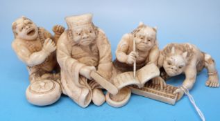 A Japanese ivory okimono of three oni and a scholar, signed, Meiji period,