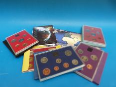 Four Royal Mint UK coin sets together with a millennium £5 crown and a 1990 USSR Leningrad mint