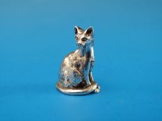 A silver cat model, probably a Siamese,
