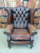 A leather Chesterfield armchair
