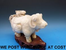 A Chinese jadeite archaistic figural lidded vase in the form of an ox,