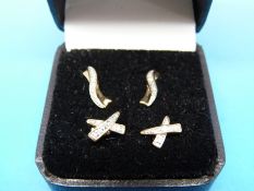 Two pairs of 9ct gold and diamond earrings