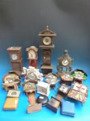 Five miniature Grandfather style clocks, four German chalet style clocks,
