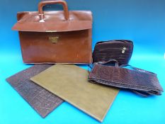 An attaché case, two stationery wallets one in wild buffalo hide together with a snakeskin bag,