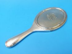 A Fabergé silver hand mirror with ribbon decoration to the back,