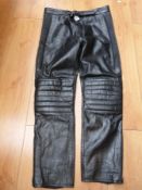 A pair of leather motorcycle trousers by 4 star together with back protector etc