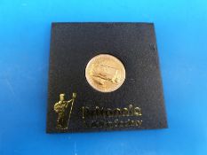 An 1897 gold proof £25 Britannia coin in perspex case