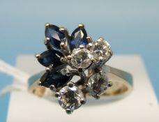 A yellow metal ring believed to be 14ct gold set with four round brilliant cut diamonds and four