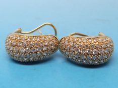 A pair of 18ct gold earrings encrusted with diamonds
