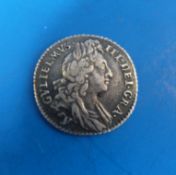 A 1606 William III sixpence