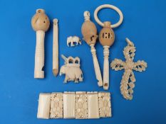 Three bone whistles, a bone bracelet,