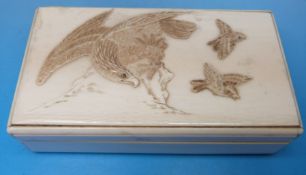 A rectangular ivory box decorated with an eagle hunting smaller birds
