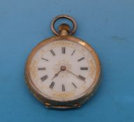 A yellow metal cased keyless wind pocket watch stamped 18k