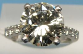 A platinum ring set with a solitaire diamond of approximately 4.
