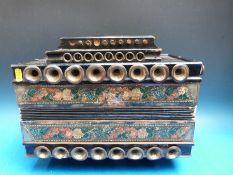 A vintage c1900 six stop melodeon a silent instrument used for stage with trumpet flares to front,