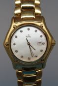 An 18ct gold Ebel 1911 wristwatch with clear stone hour markers and date aperture on mother of