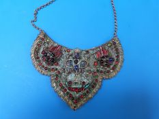 A Tibetan/Nepalese necklace with multicoloured stones on brass mount