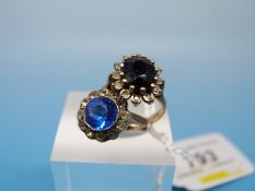 Two 9ct gold rings each set with clear and blue stones