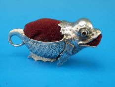 A rare, probably Chinese hallmarked silver pin cushion in the form of a mythical/grotesque fish,