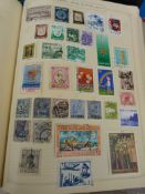 A box of albums and loose stamps,