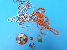 Three coral necklaces, other beads, an agate specimen brooch, necklace set with moss agate,