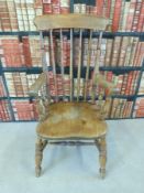 An oak Windsor chair with turned decoration and double stretcher stamped EG to reverse