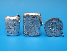Three white metal golfing interest vesta cases including a circular example,