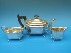 A hallmarked silver three piece tea set,
